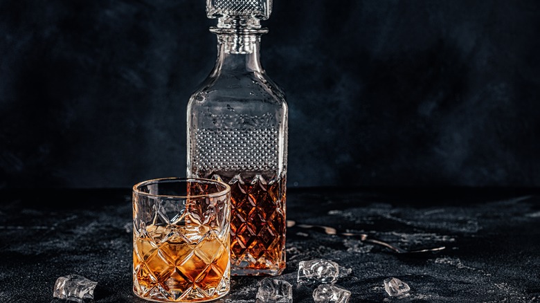 Whiskey decanter with rocks glass and ice