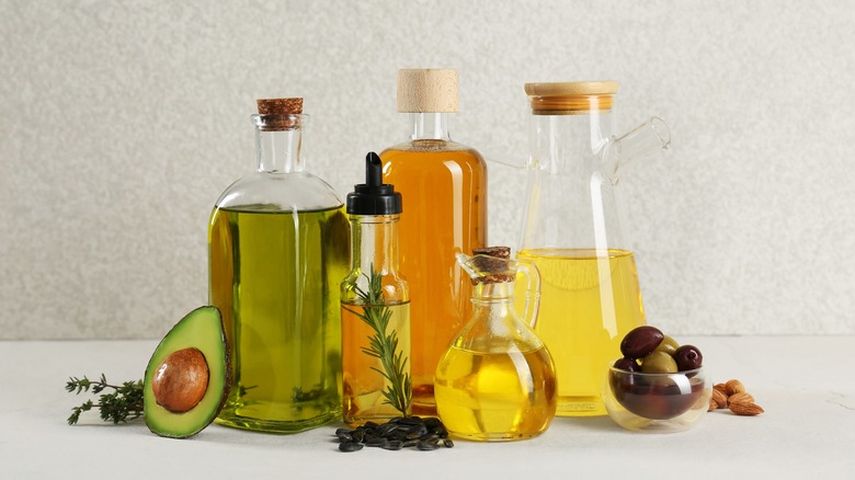 a variety of cooking oils in glass bottles