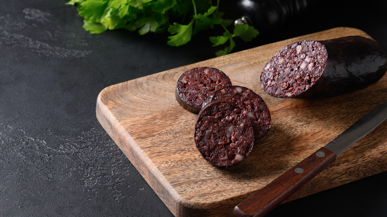 Black pudding sliced on cutting board