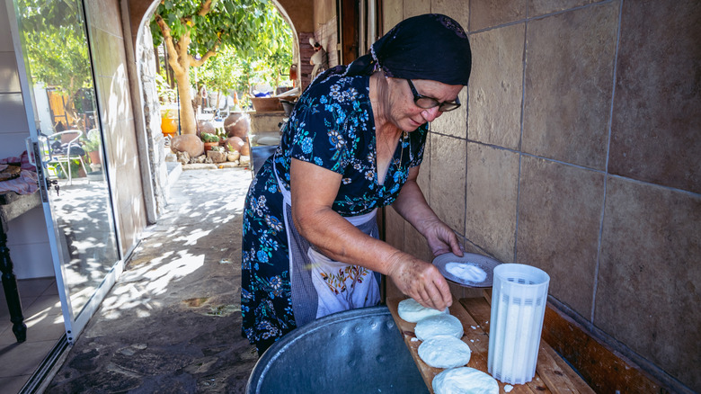 A woman makes halloumi in a village in Cyprus.