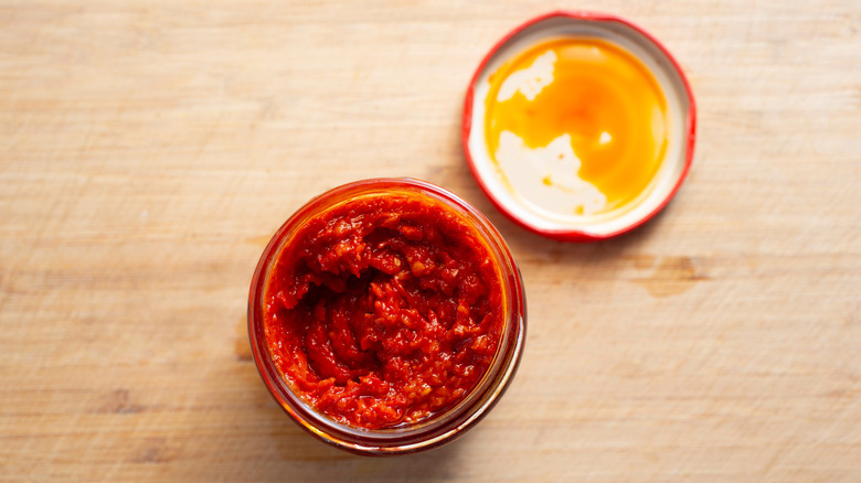 Top-down view of a jar of harissa