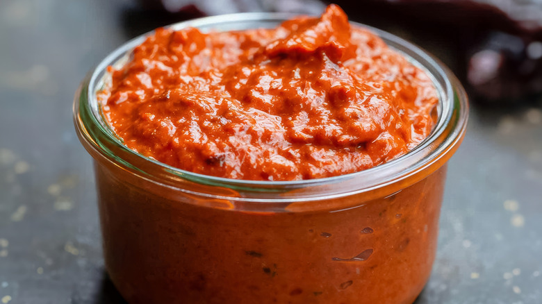 Harissa in a short glass jar