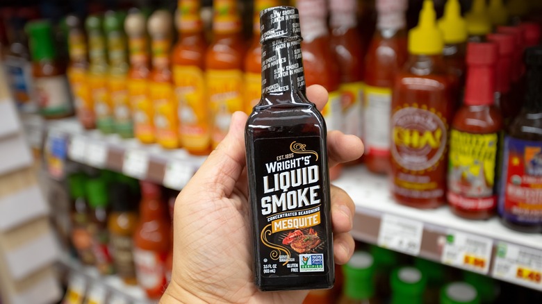 hand holding Wright's liquid smoke