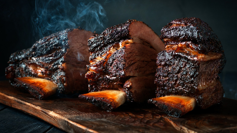 smoked brisket sitting on board