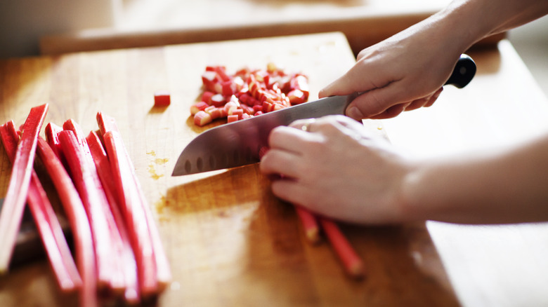 chopping rhubarb stems