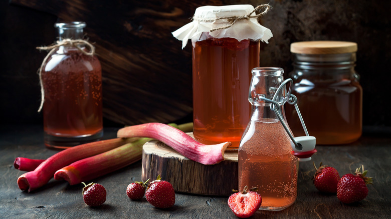 rhubarb syrups in jars, rhubarb and strawberries