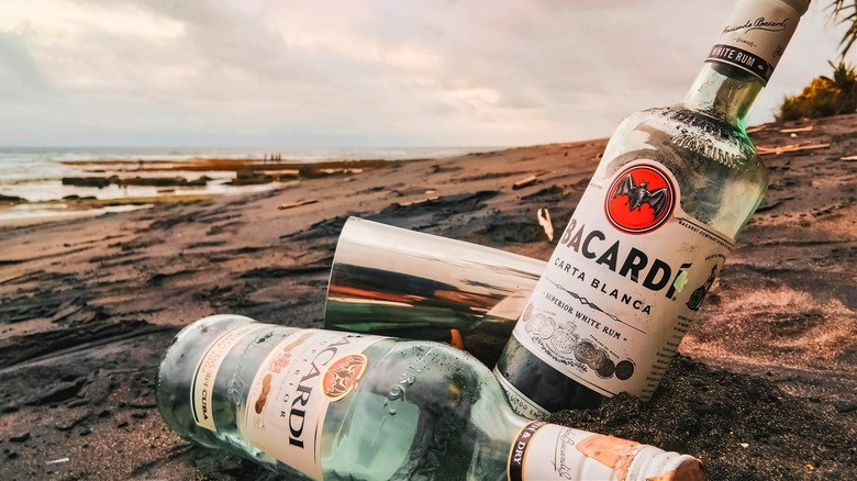 Bottle of rum on beach