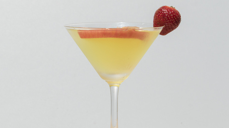 Soju cocktail in martini glass with strawberry garnish