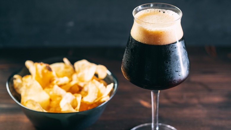 bowl of chips and glass of stout