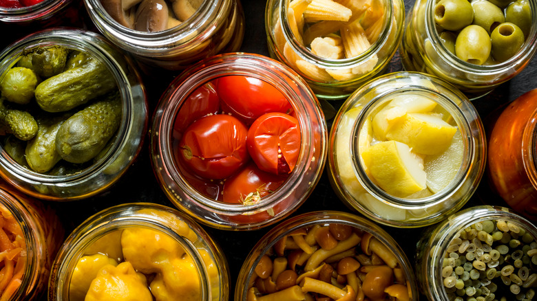 Overhead view of pickled vegetables in jars