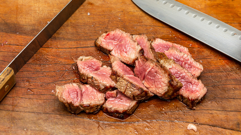 Chopped steak on cutting board