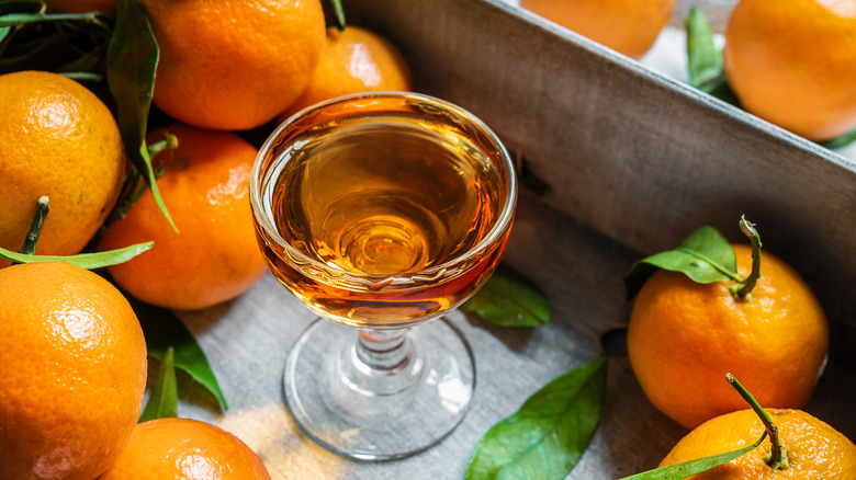 glass of liqueur and tangerines