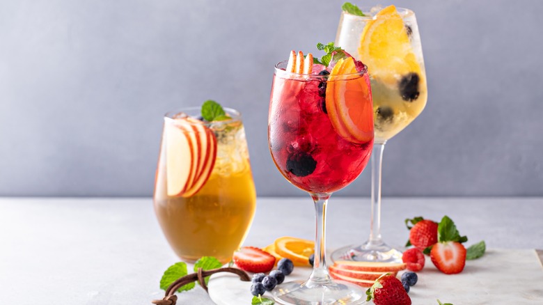 three glasses of sangria with fruit