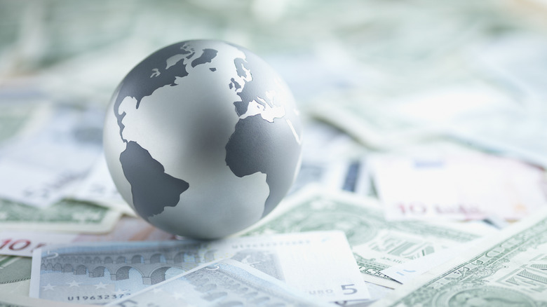 Globe with international currencies
