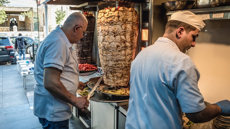 Lebanese cook making shawarma