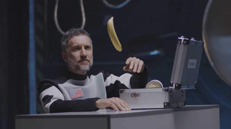 Astronaut with floating banana