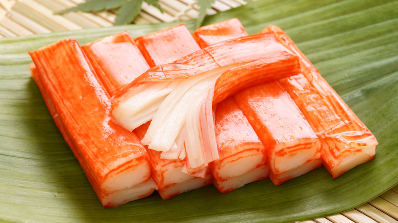 a stack of crab stick on a green leaf