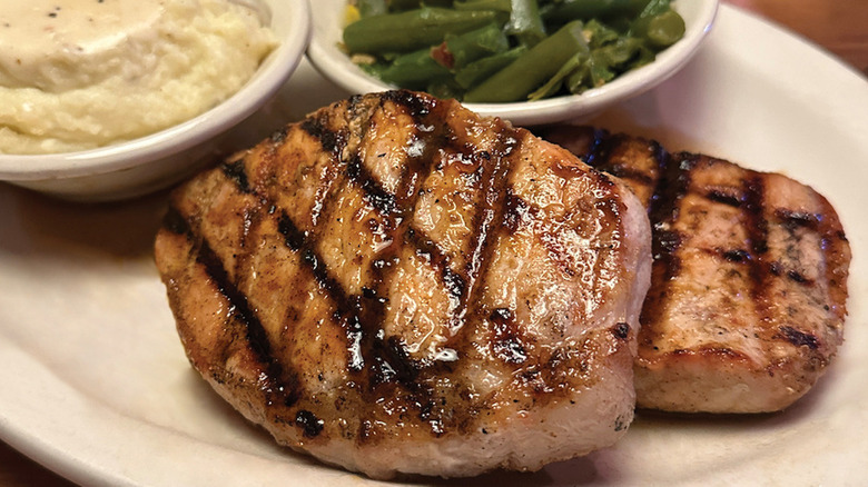 Texas Roadhouse pork chop meal with sides