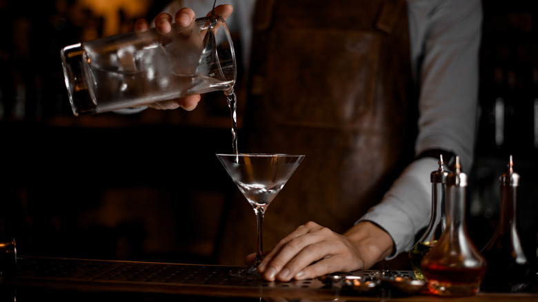 A man pours a martini 