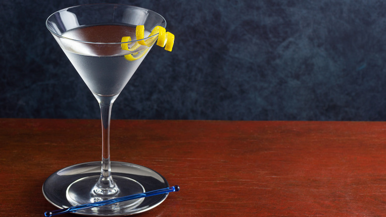 A single martini glass with lemon twist 