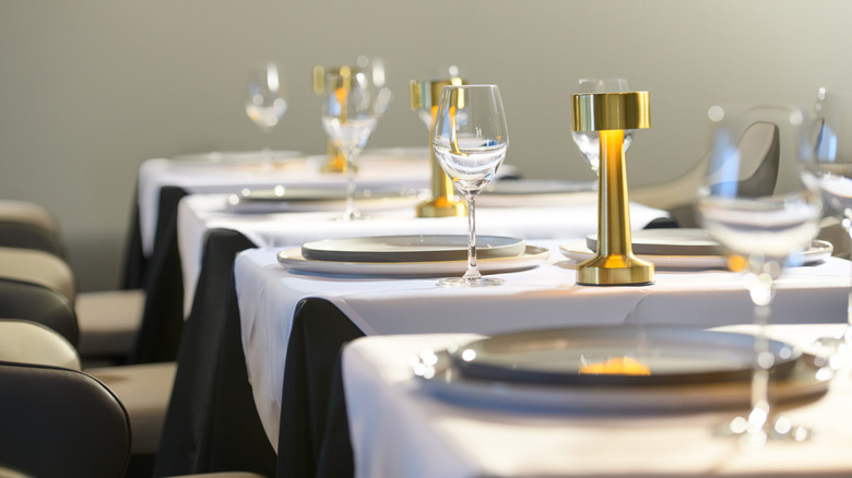 Restaurant tables with fancy place settings