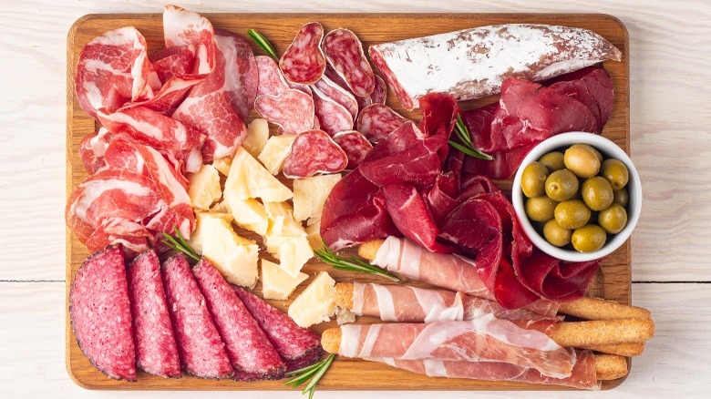 Charcuterie board with cured meats