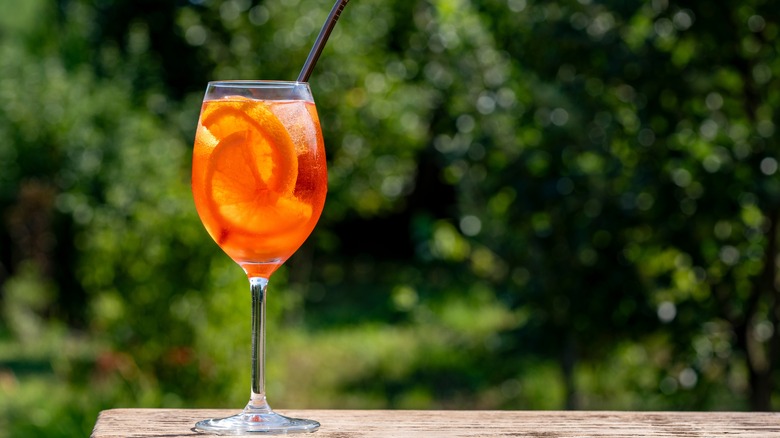 Aperol spritz cocktail with nature background