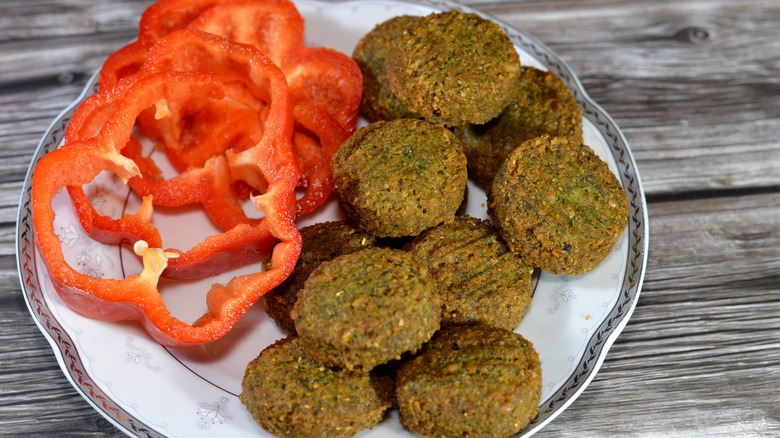 Ta'ameya on plate with red bell pepper