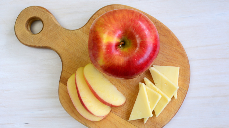 Honeycrisp apple with cheese on board