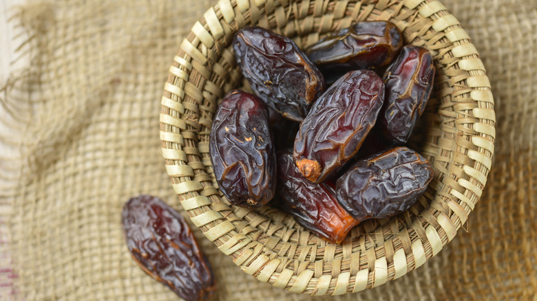 Woven bowl full of medjool dates