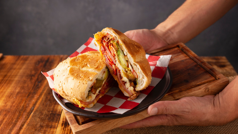 person holding torta served on tray