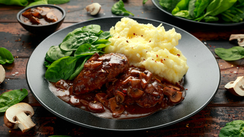 Salisbury steak with spinach and mashed potatoes