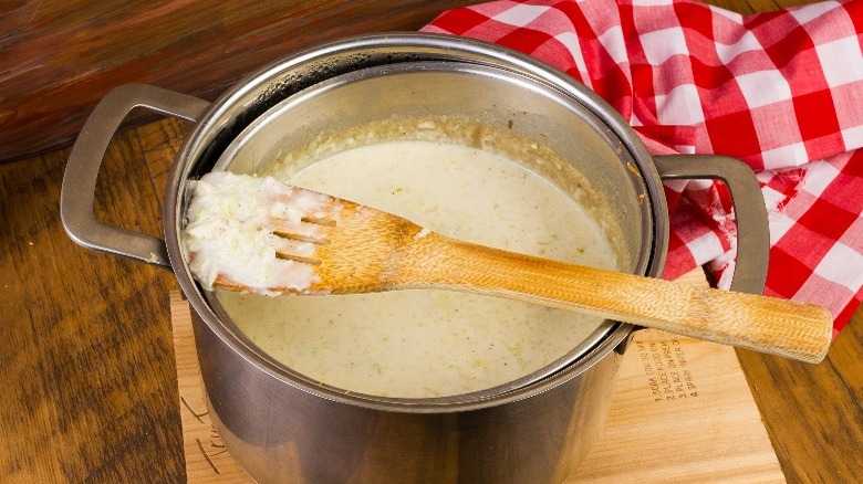 Pot of she-crab soup with wooden spoon