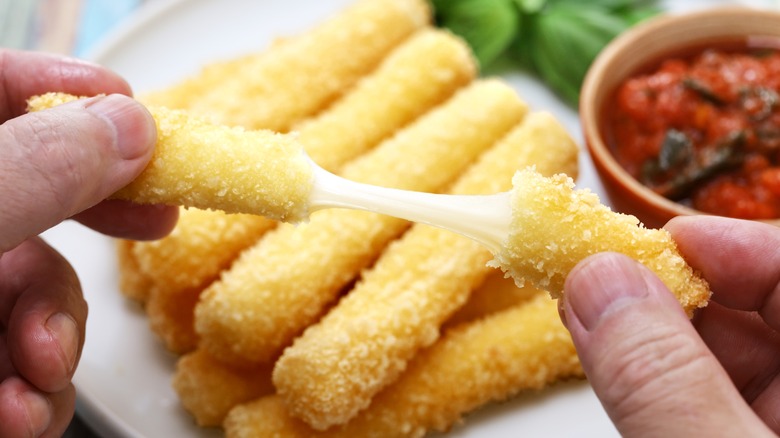 Fried mozzarella stick showing how mozzarella melts differently from string cheese