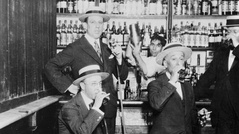 1920s men drinking in speakeasy 