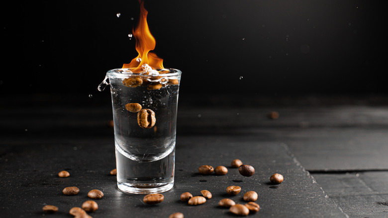 shot of sambuca lit on fire with coffee beans