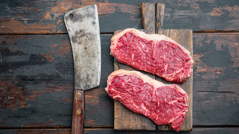 Steak cuts on a wooden plank