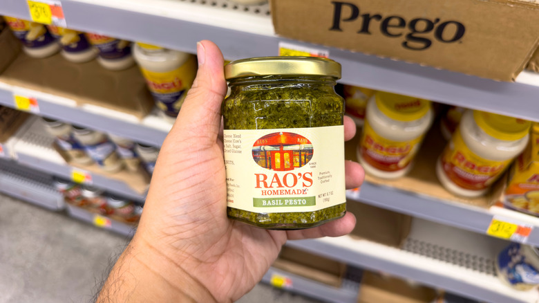 Hans holds a jar of Rao's pesto