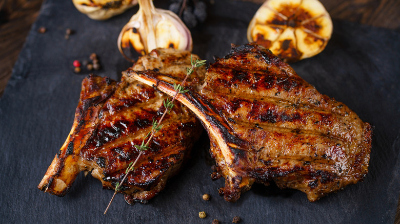 Grilled cowboy steaks on a slate