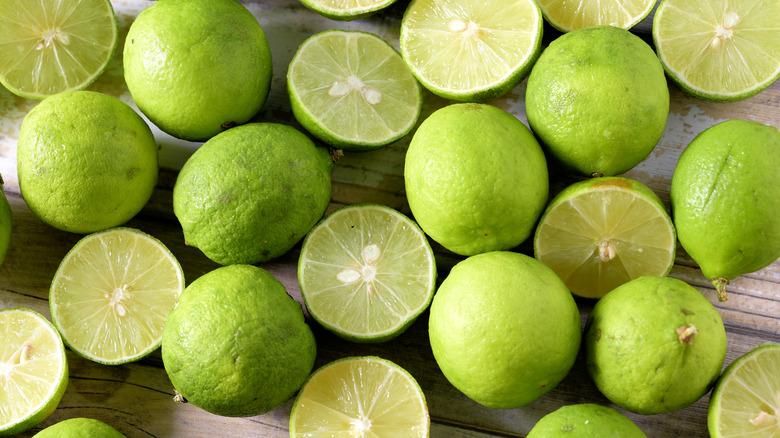 Key limes on a wooden surface