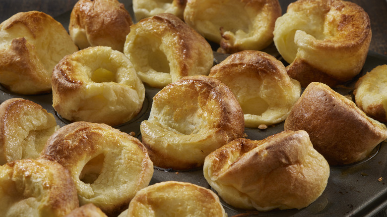 Close-up of individual Yorkshire puddings in baking tin