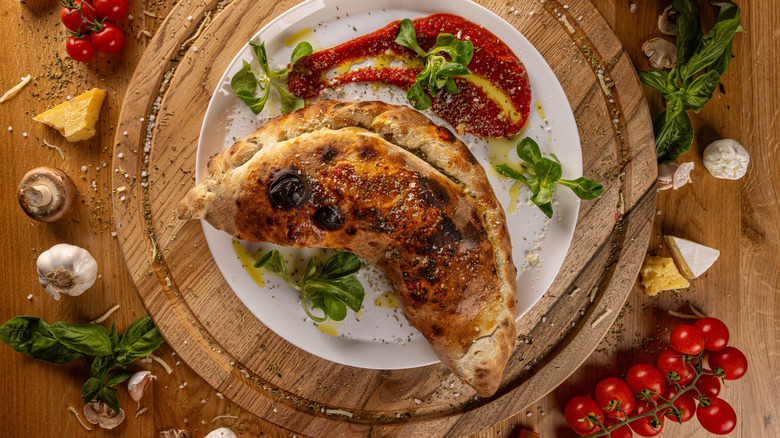 Calzone on wooden board