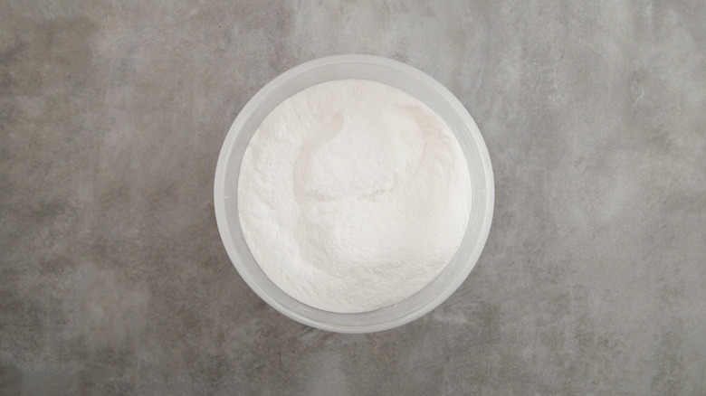 Container of transglutaminase powder