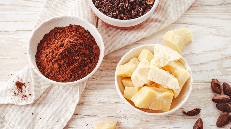 Bowls of cocoa powder and cocoa butter