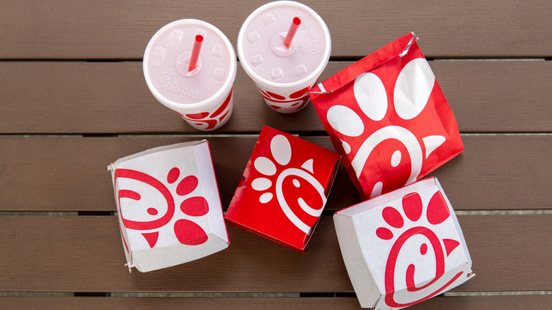 a variety of food items and drinks from Chick-fil-A in a top view