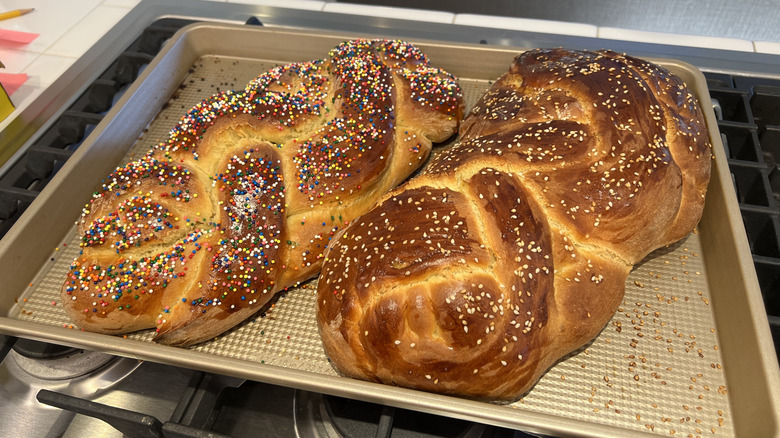 Challah bread with seeds and sprinkles on cookie sheet