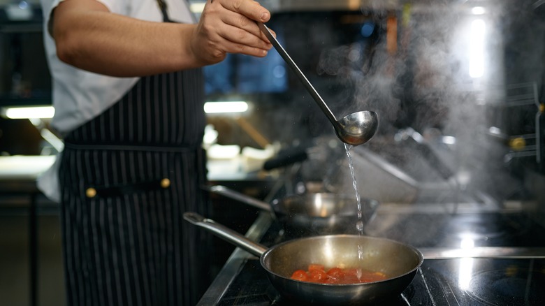 Adding water to pan sauce