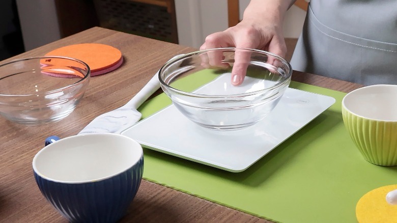 Taring a scale with an empty bowl on it