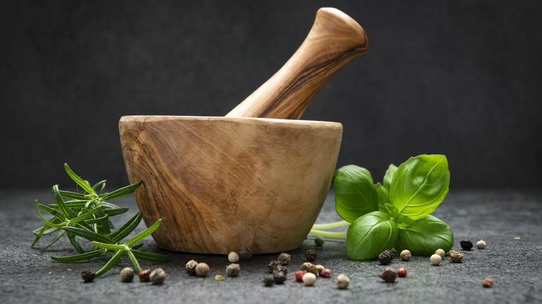 Mortar and pestle with herbs