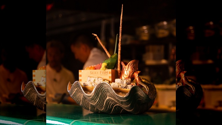 An assortment of sushi in large clam shell at Sexy Fish